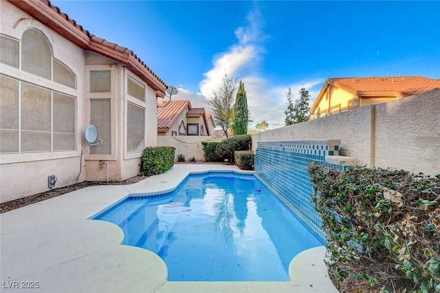 view of pool with a patio, a fenced backyard, and a fenced in pool