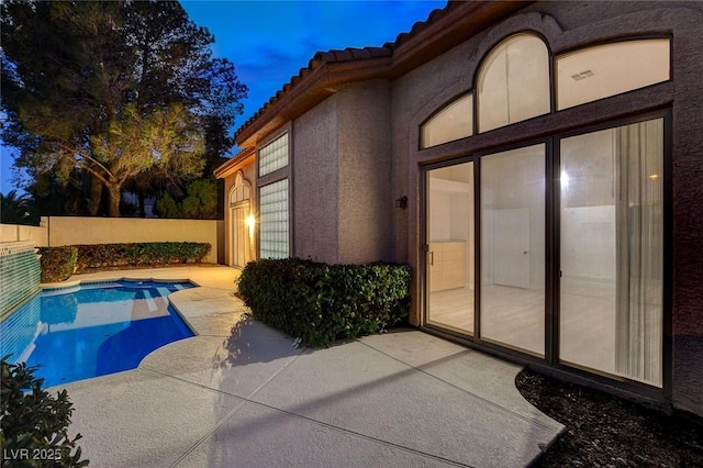 view of swimming pool featuring a fenced in pool, a patio, and fence