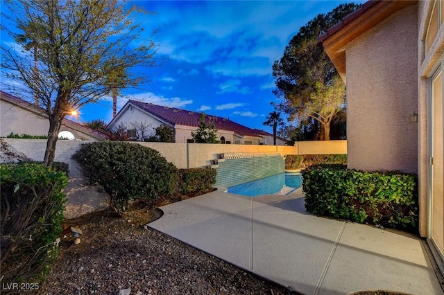 view of swimming pool with a patio and a fenced backyard