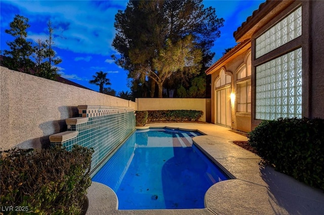 view of swimming pool with a fenced in pool and a fenced backyard