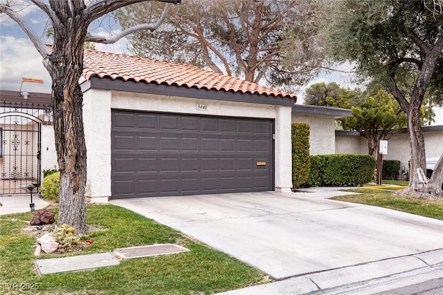 exterior space featuring stucco siding, concrete driveway, and a tile roof