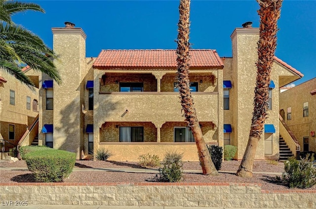 view of property featuring stairway