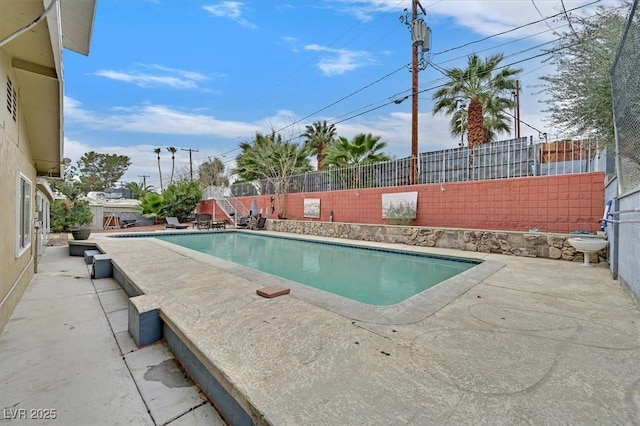 view of pool with a patio area, a fenced backyard, and a fenced in pool