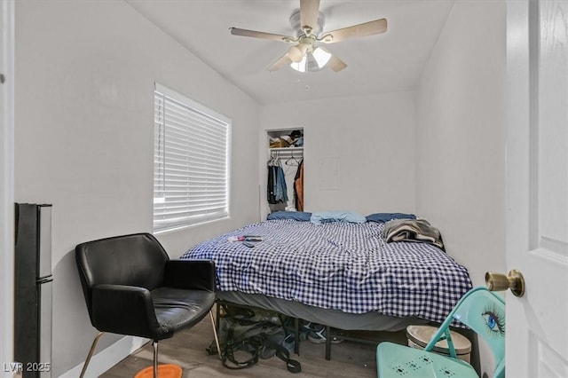 bedroom featuring ceiling fan and wood finished floors