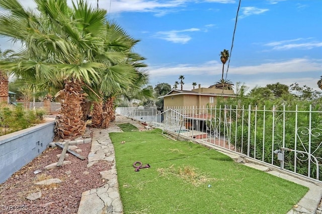 view of yard featuring a garden and fence