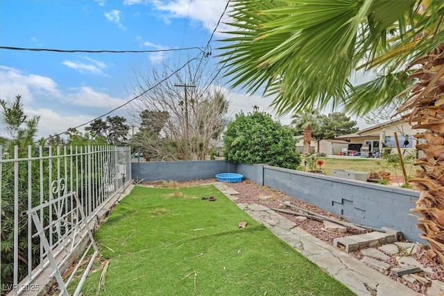 view of yard featuring a fenced backyard