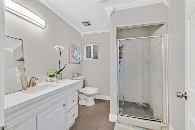 full bathroom with toilet, a marble finish shower, visible vents, and crown molding