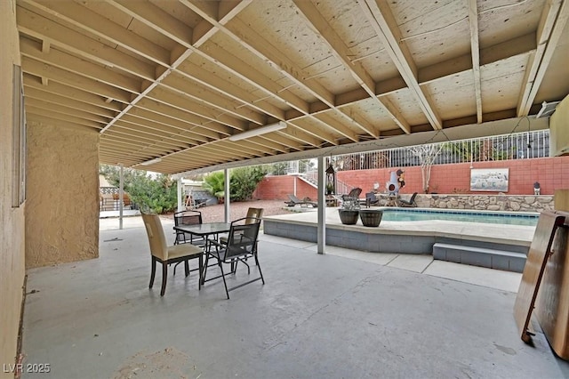 view of patio / terrace featuring fence and outdoor dining space