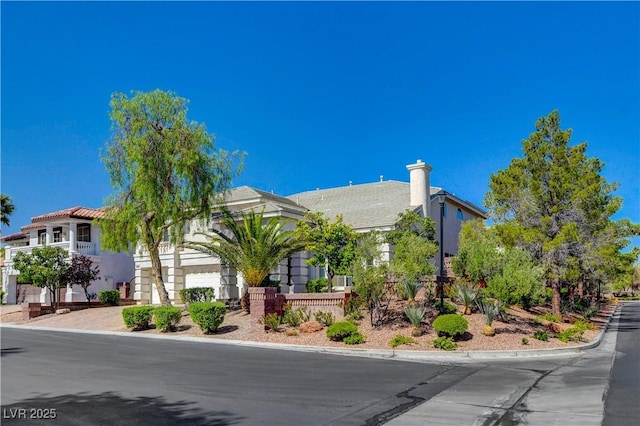 view of front of house with decorative driveway