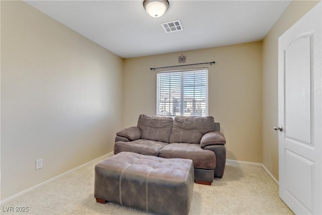 living area with baseboards, visible vents, and carpet flooring