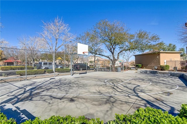 exterior space with community basketball court and fence