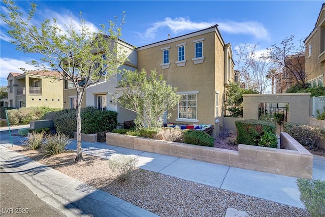 view of front of house featuring stucco siding