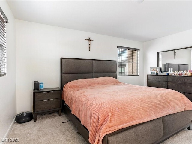 carpeted bedroom with baseboards