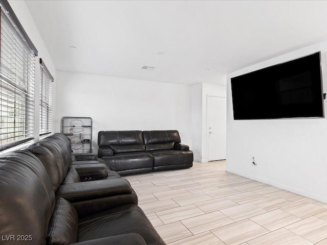 living area featuring visible vents and baseboards