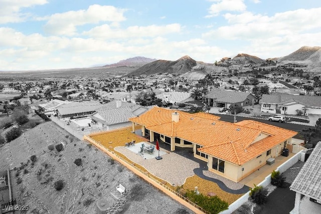 birds eye view of property with a residential view and a mountain view