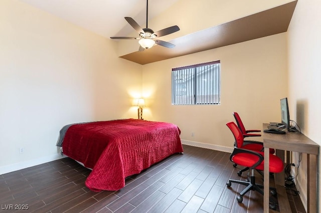 bedroom with ceiling fan, vaulted ceiling, baseboards, and wood finished floors