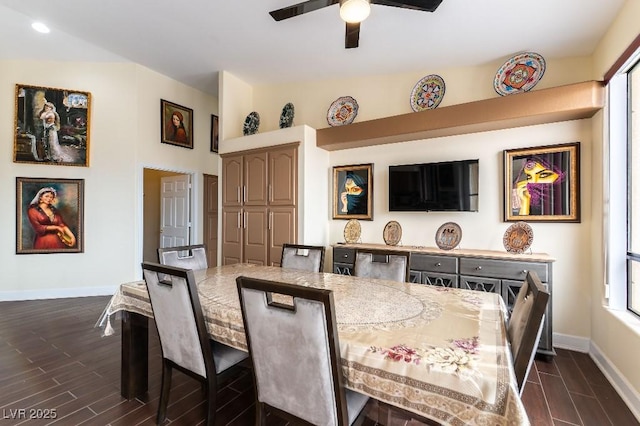 dining room with wood finish floors, ceiling fan, lofted ceiling, and baseboards