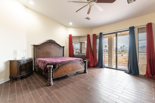 bedroom with ceiling fan, dark wood finished floors, visible vents, and access to exterior