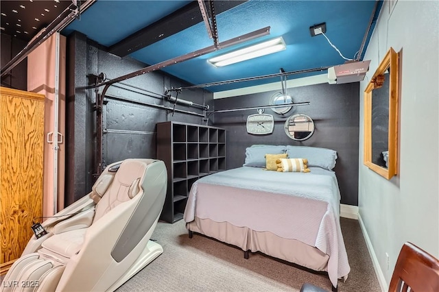 bedroom with a garage, carpet, and baseboards