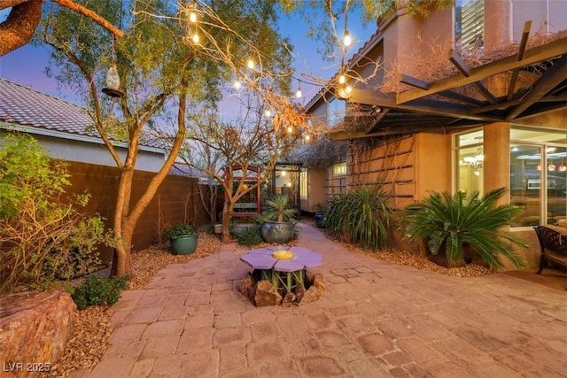 patio terrace at dusk with fence