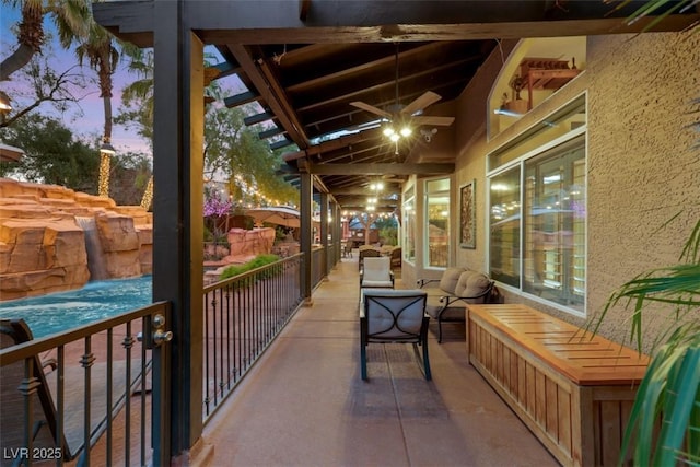 view of patio featuring a balcony