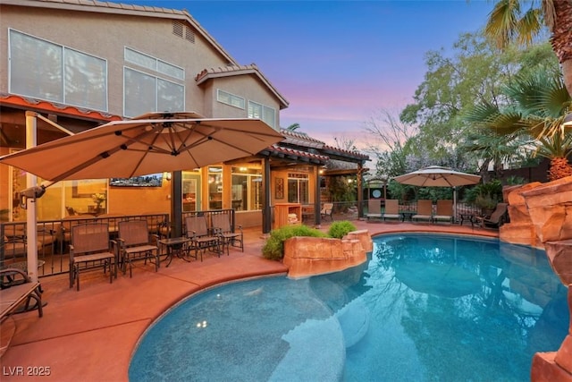 view of swimming pool with a fenced in pool, a patio area, and fence