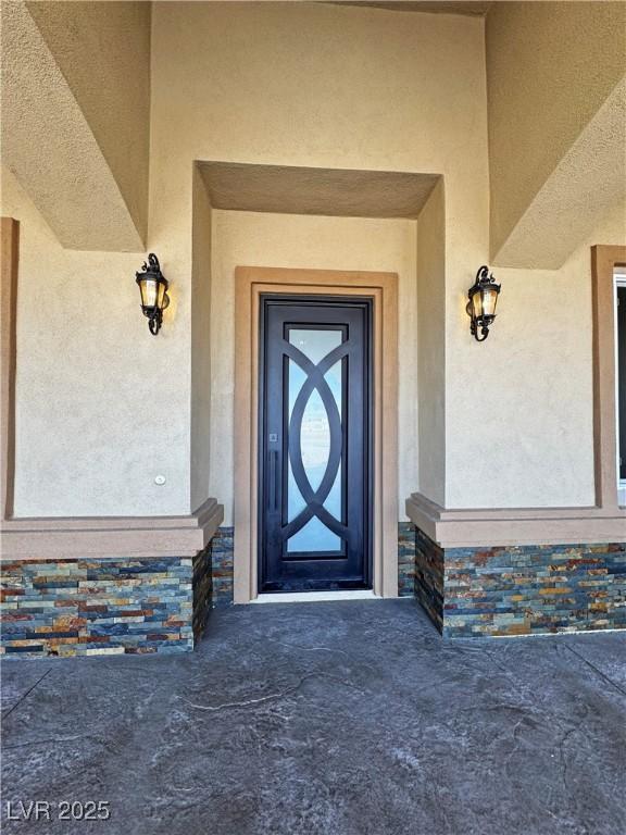 3080 S Prairie Ave, Pahrump, NV 89048 - view of exterior entry featuring stucco siding