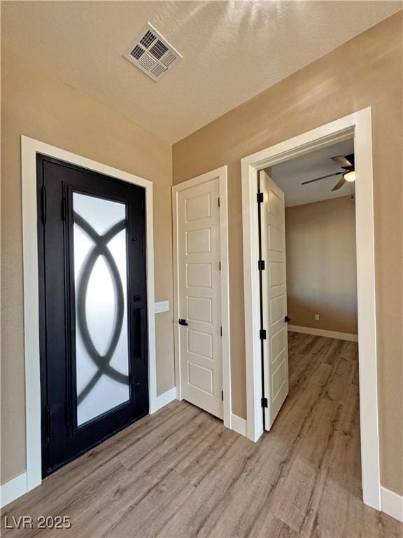 3080 S Prairie Ave, Pahrump, NV 89048 - foyer entrance with wood finished floors, baseboards, and ceiling fan