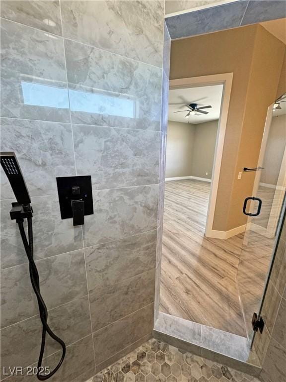 3080 S Prairie Ave, Pahrump, NV 89048 - full bathroom with a stall shower, baseboards, and ceiling fan