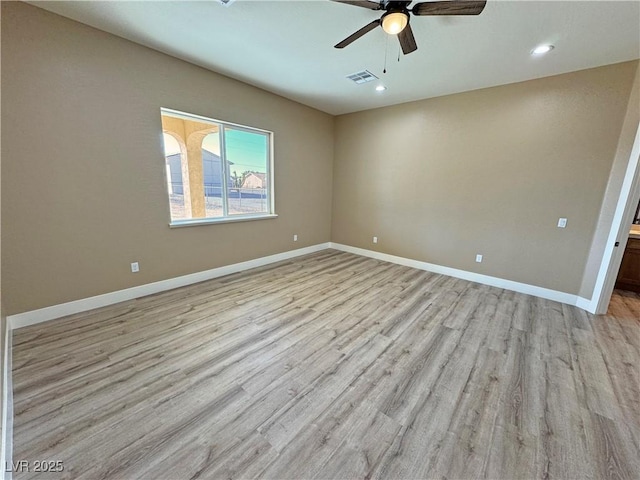3080 S Prairie Ave, Pahrump, NV 89048 - empty room featuring light wood-type flooring, ceiling fan, baseboards, and recessed lighting