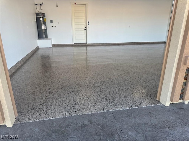 3080 S Prairie Ave, Pahrump, NV 89048 - garage featuring water heater and baseboards