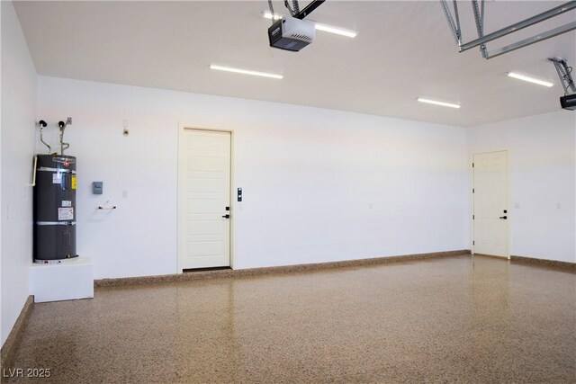 3080 S Prairie Ave, Pahrump, NV 89048 - garage with secured water heater, baseboards, and a garage door opener