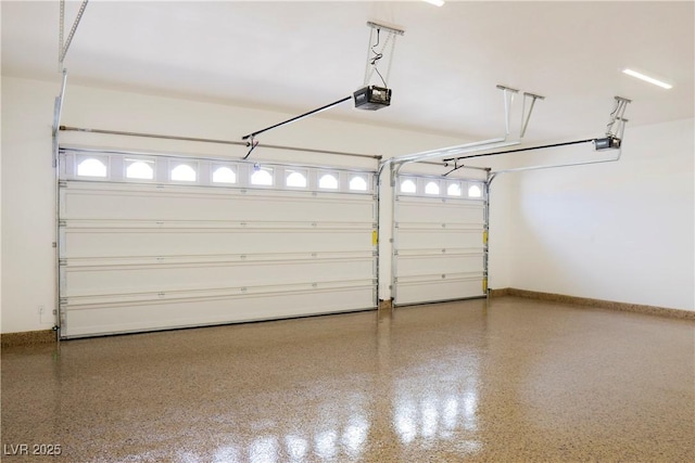 3080 S Prairie Ave, Pahrump, NV 89048 - garage featuring baseboards and a garage door opener