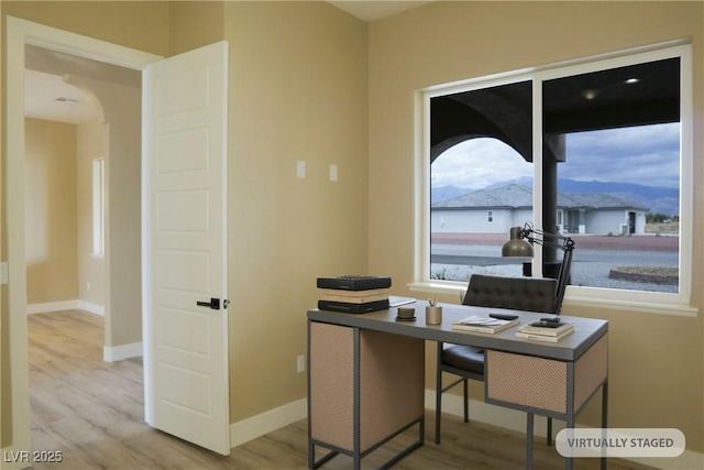 3080 S Prairie Ave, Pahrump, NV 89048 - office space with arched walkways, wood finished floors, and baseboards