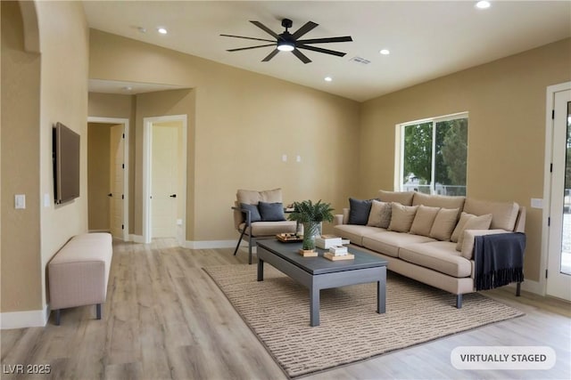 3080 S Prairie Ave, Pahrump, NV 89048 - living area featuring light wood-style flooring, ceiling fan, recessed lighting, lofted ceiling, and baseboards