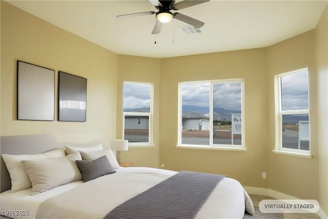 3080 S Prairie Ave, Pahrump, NV 89048 - bedroom featuring baseboards and ceiling fan