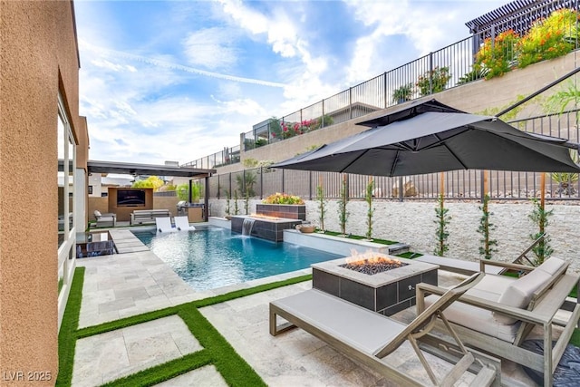 view of pool with a fenced in pool, area for grilling, an outdoor fire pit, a patio area, and a fenced backyard