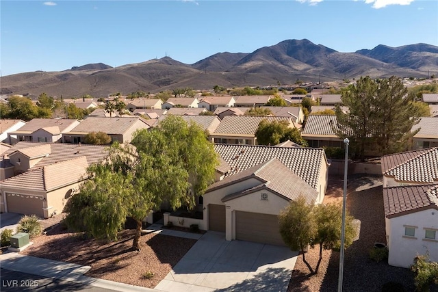 drone / aerial view with a residential view and a mountain view