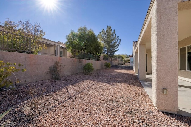 view of yard with a patio area and a fenced backyard