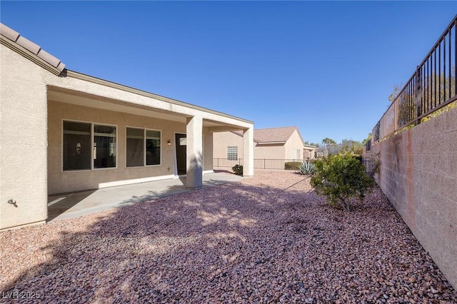 view of yard featuring a fenced backyard and a patio