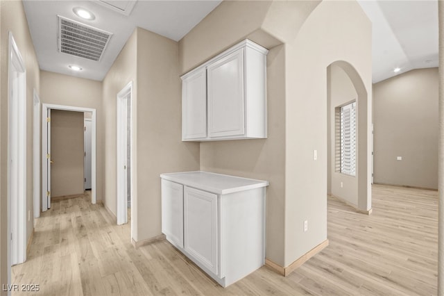 corridor featuring recessed lighting, light wood-style floors, visible vents, and baseboards