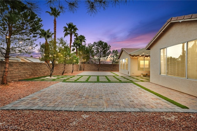 view of yard featuring a patio and a fenced backyard