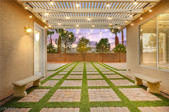 view of yard with a patio, a fenced backyard, and a pergola