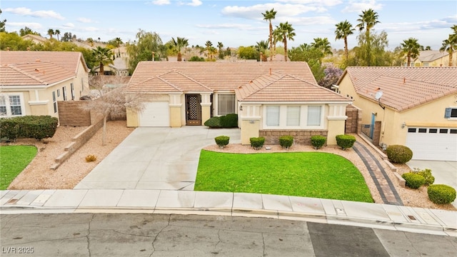 view of front of property featuring a tiled roof, driveway, an attached garage, and a front yard