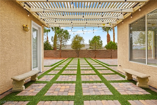 view of yard featuring a patio area, a pergola, and a fenced backyard