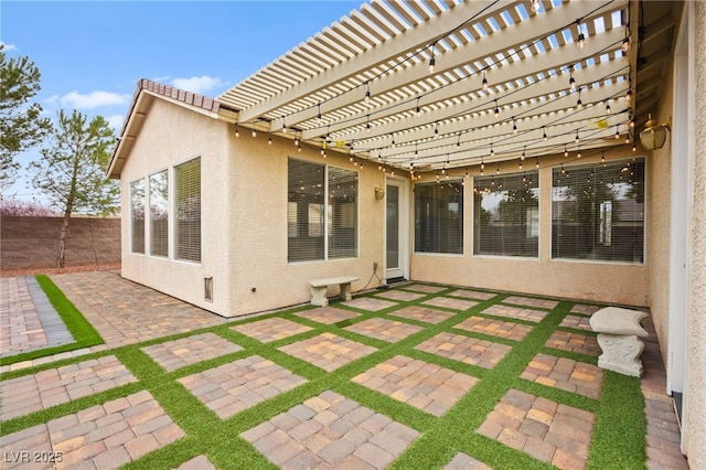 view of patio with fence and a pergola