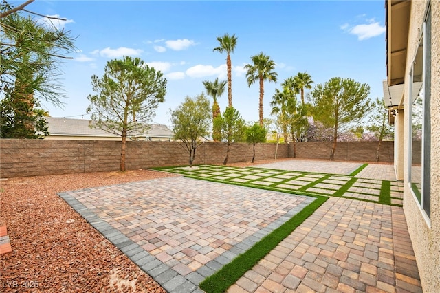 view of yard with a fenced backyard and a patio area