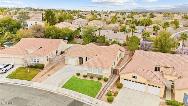 birds eye view of property with a residential view