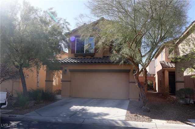 view of front of house with stucco siding, concrete driveway, an attached garage, and a tiled roof