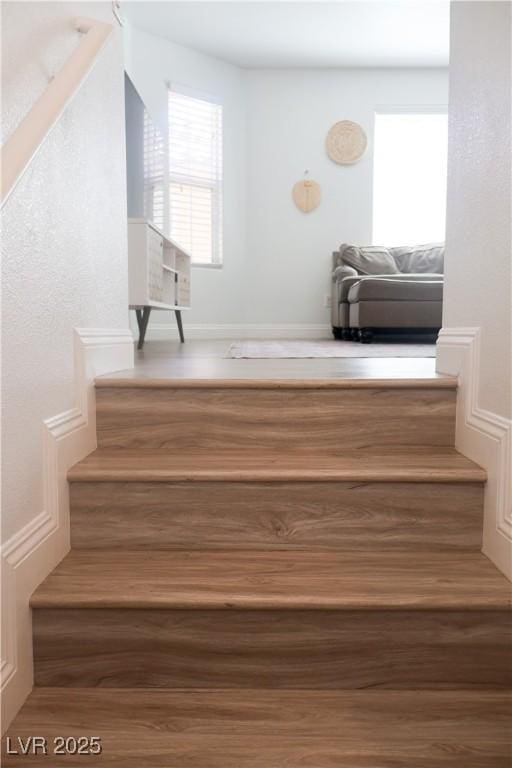 stairway with wood finished floors